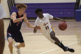 Lemoore's Chris Taylor has his eye on the basket during Wednesday's 67-59 victory over visiting Tulare Western. It was the Tigers' season opener.